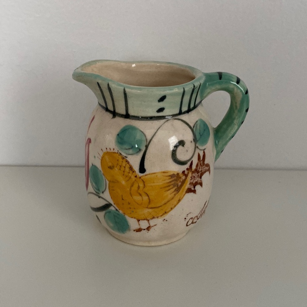 Vintage pottery creamer with baby chick